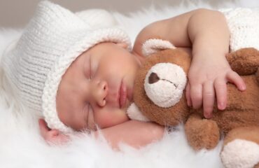 new born baby with teddy