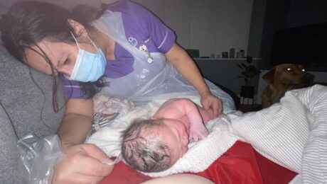 checking the new born after a water birth with Private Midwives